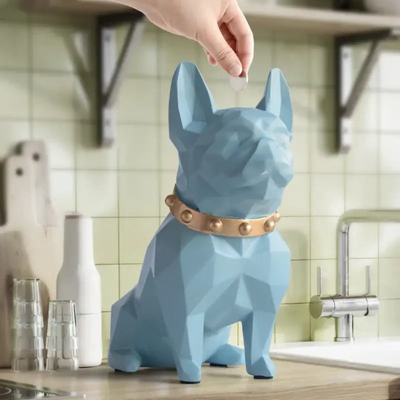 A light blue geometrically designed french bulldog coin bank with a brass studded collar decorbites french bulldog decor
