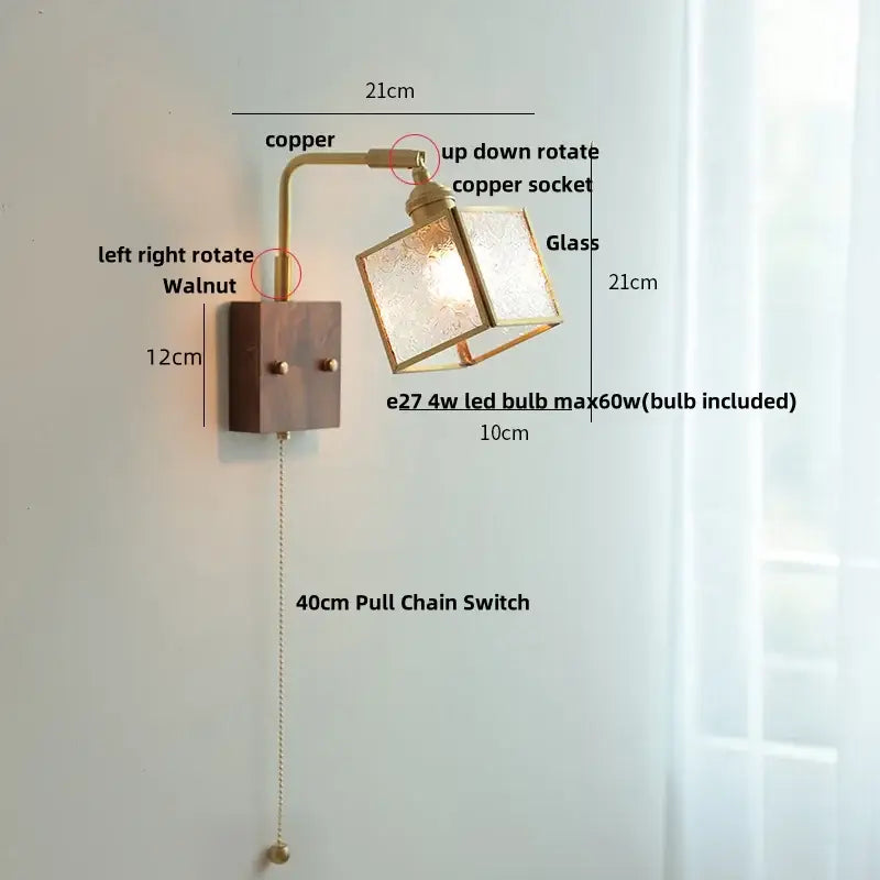 A brass led wall light with a frosted glass cube and dark walnut base for dining room decorbites brass led lighting