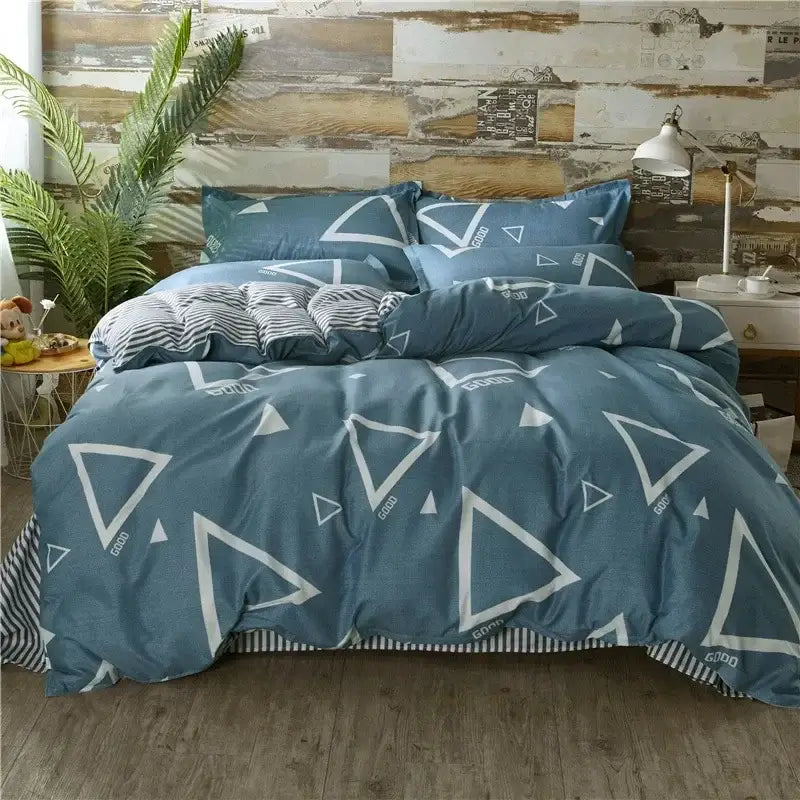 King size blue duvet set with white geometric triangle patterns and striped accents from decorbites cartoon king