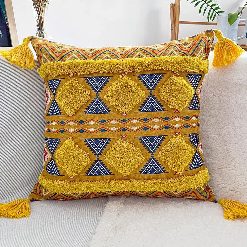Vibrant mustard yellow decorbites geometric bohemian pillow case with textured pom-poms and tassels for living room decor