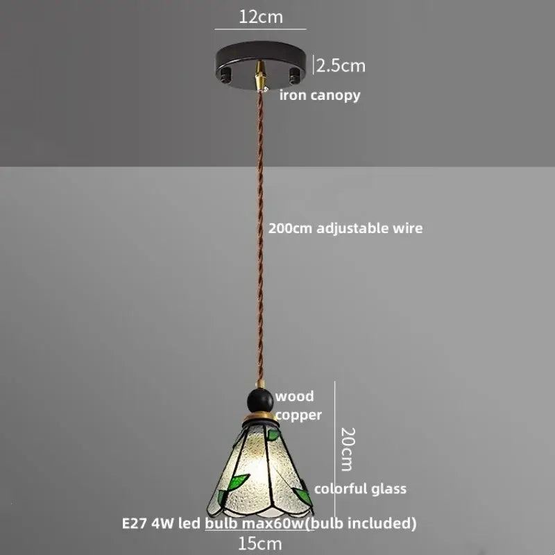 Delicate tiffany-style pendant light with green leaf stained glass shade and copper wire from black iron canopy decorbites clear glass led