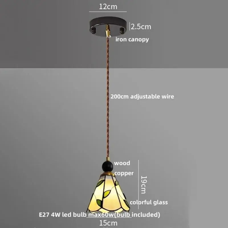 A vintage-style pendant light with black iron canopy, copper suspension, and stained glass shade for decorbites clear glass