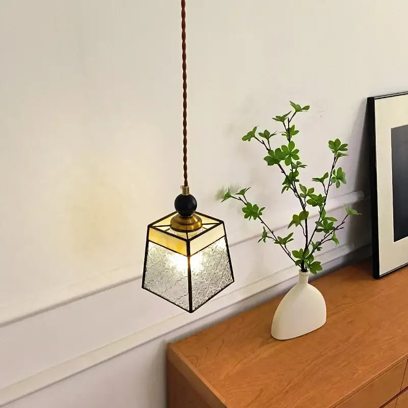Geometric brass and clear glass led pendant light with warm-toned metal frame and decorbites clear glass panels for dining room