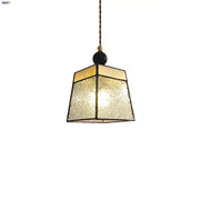 Geometric brass and clear glass led pendant light with textured panels for dining room featuring decorbites clear glass