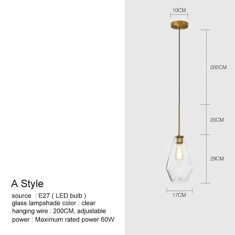 A modern brass-finished pendant light with a clear faceted glass chandelier lighting and adjustable 200cm wire