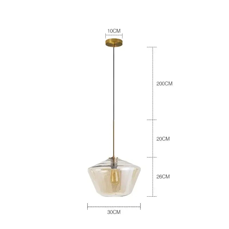 A modern pendant light with a clear textured glass chandelier lighting and brass finished metal for kitchen use