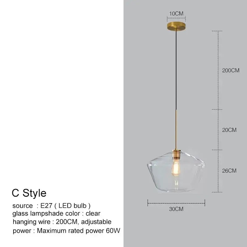 Clear glass lampshade with brass-finished metal fixture and hanging wire in geometric brass and glass chandelier lighting pendant light