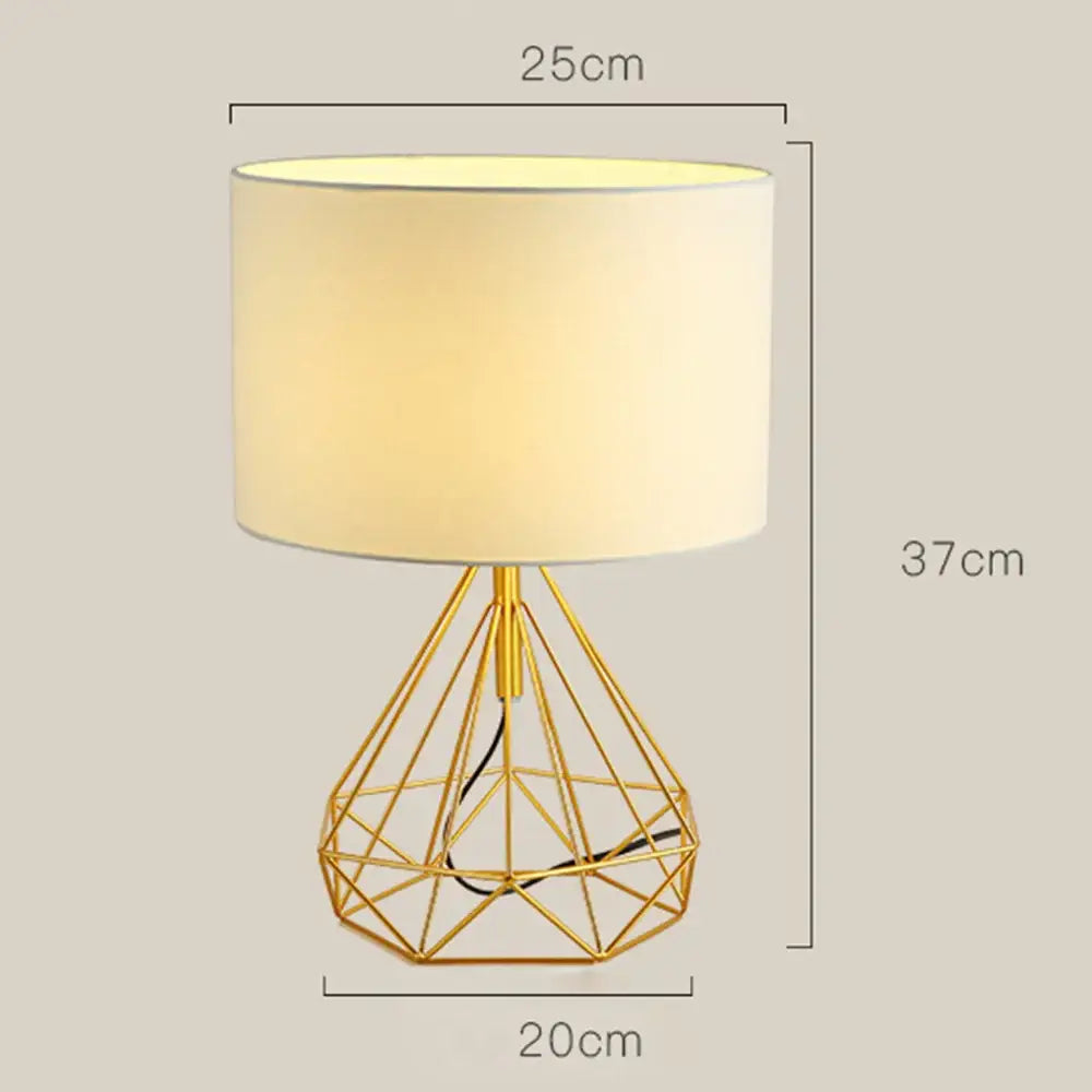 Gold geometric wire desk lamp with cream decorbites linen fabric shade ideal for bedroom night light