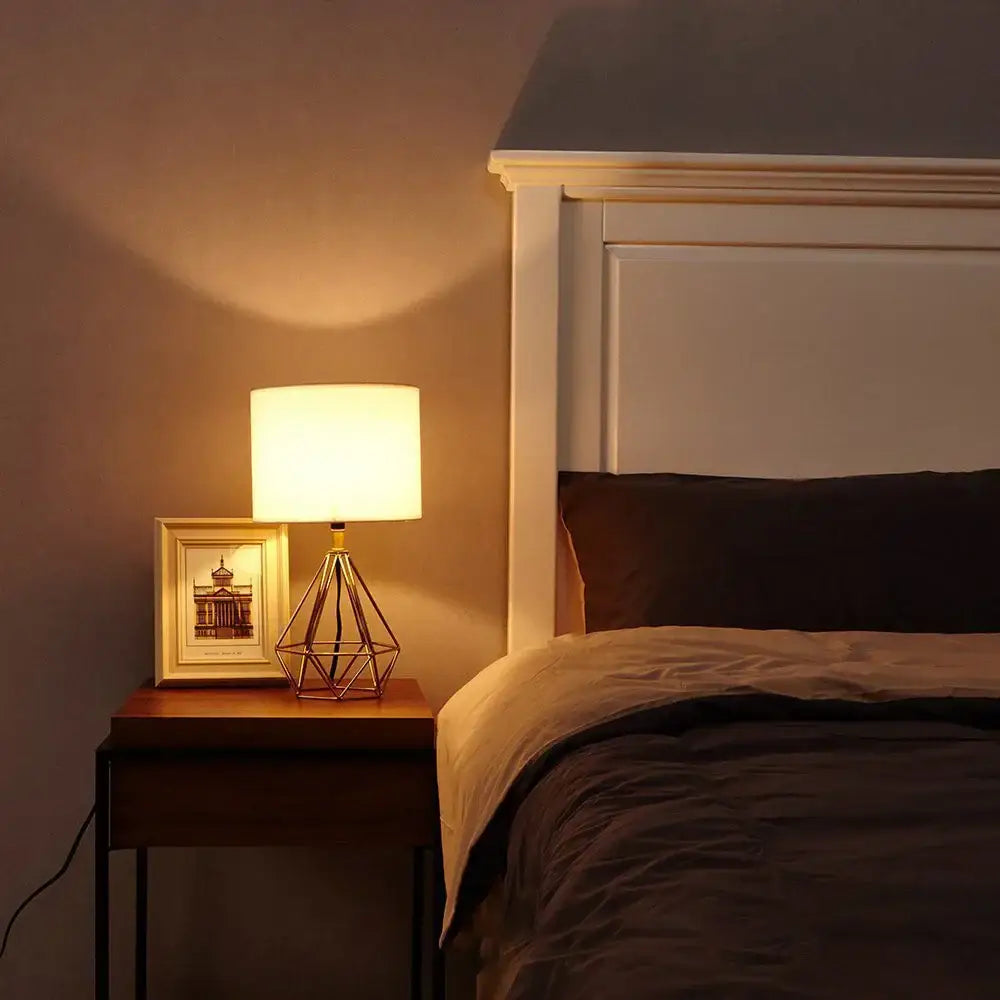 Warm-toned geometric brass desk lamp with cylindrical linen fabric led shade for bedroom night light decorbites linen fabric