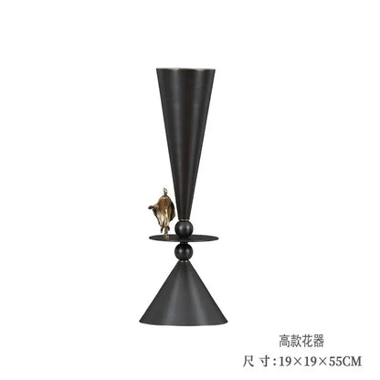 Black matte geometric bronze vase with conical shape and gold figurine decorbites geometric bronze decor piece