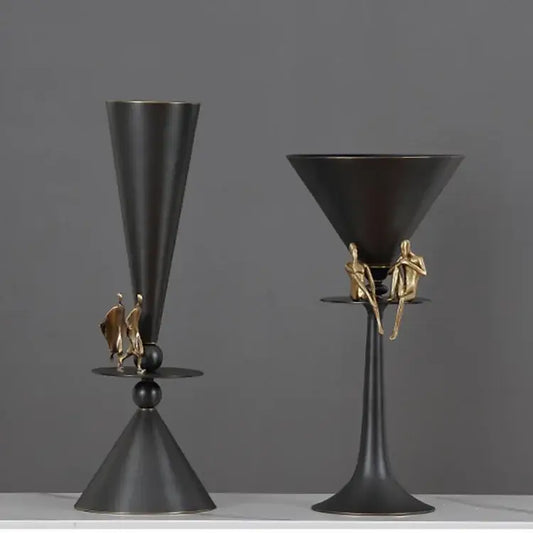 Black metallic cocktail glasses with gold figurines on stems showcasing decorbites geometric bronze dining room decorbites geometric bronze