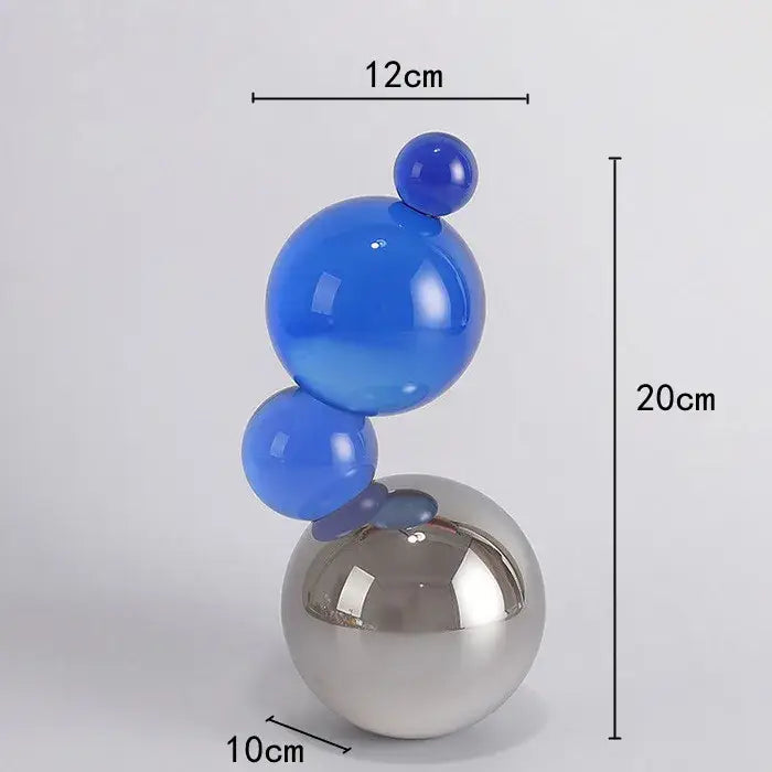 A sleek geometric butterfly blue crystal ball sculpture with glossy glass spheres for modern home decor