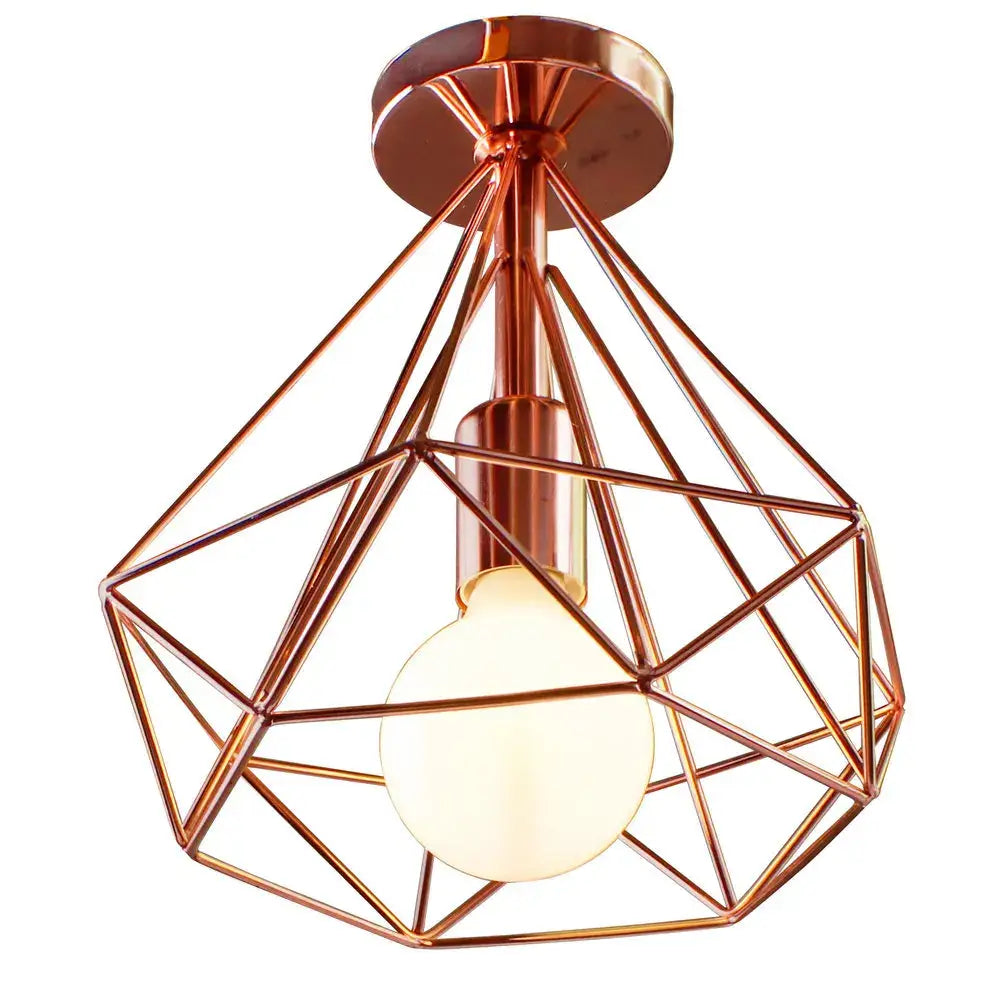 Copper geometric cage iron ceiling light fixture with warm-toned bulb suitable for dining room lighting