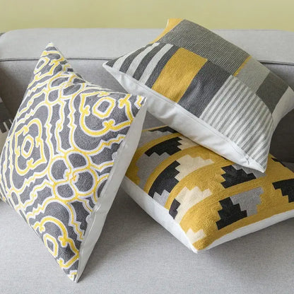 Three decorative throw pillows with embroidered geometric canvas cotton cushion cover in yellow and grey for living room decorbites