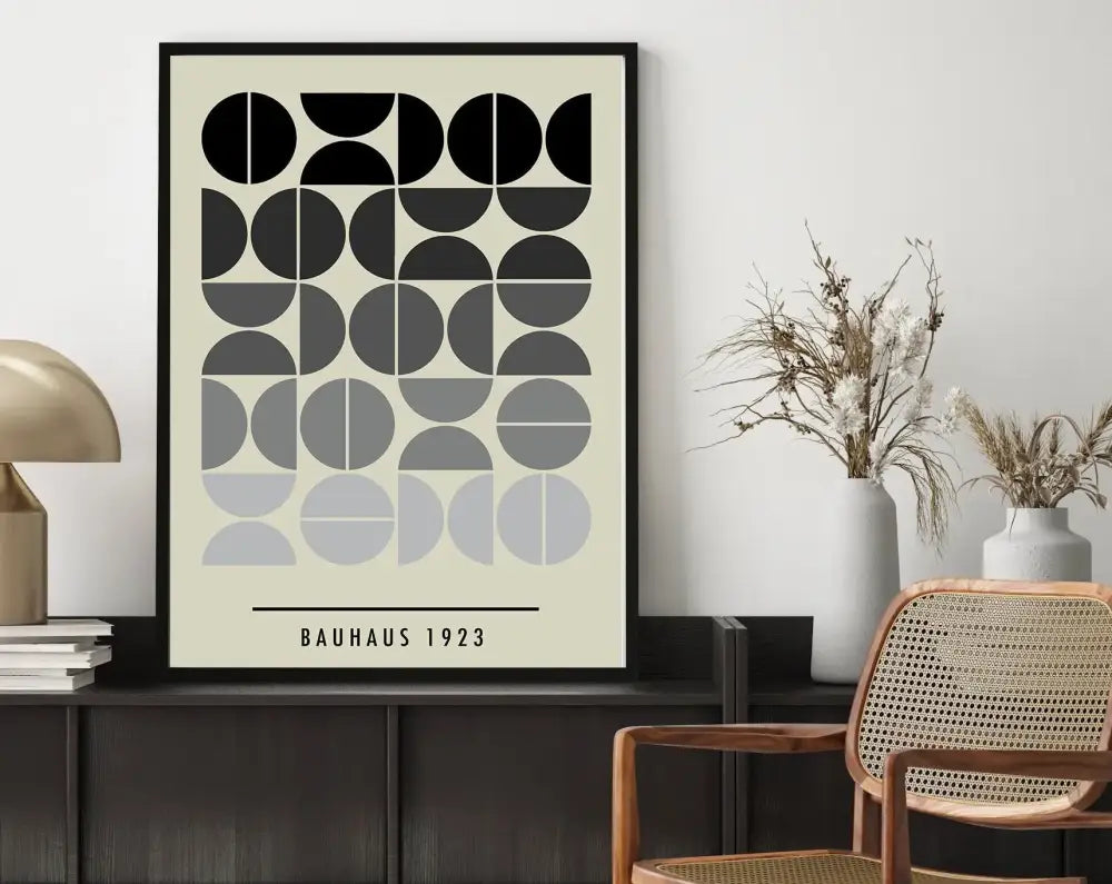Black-framed bauhaus geometric canvas print with black gray and off-white circles on ivory for home decor