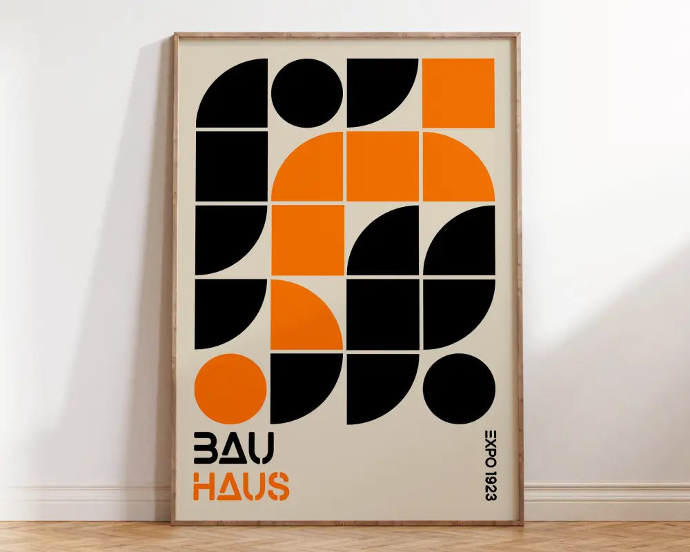 A framed DecorBites™ bauhaus geometric canvas print with bold black and orange shapes for modern home decor