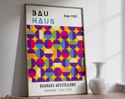 A framed DecorBites™ bauhaus geometric canvas print with vibrant overlapping colored circles on white background