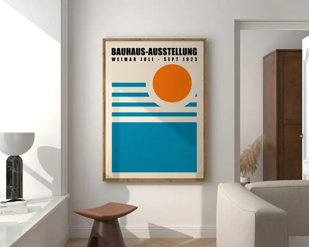 A framed bauhaus geometric canvas print with bold orange and teal design for modern home decor on a white wall