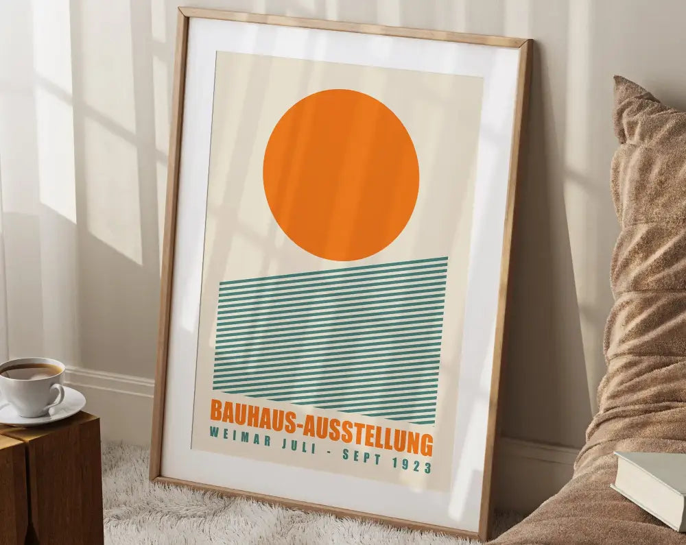 A framed bauhaus geometric canvas print with bold orange circle and teal stripes for modern home decor by decorbites