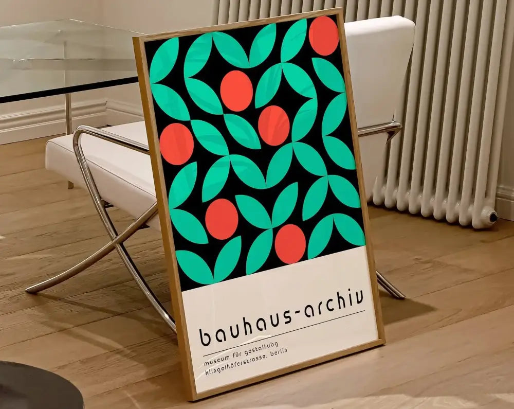 A framed bauhaus geometric canvas print with teal leaves and red circles on black background for home decor