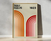 Minimalist framed decorbites bauhaus geometric canvas print with retro orange and red curved arches on cream background