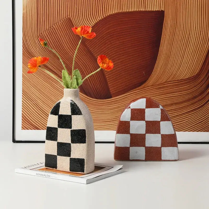 Beige ceramic vase with black and white geometric check pattern featuring narrow neck for living room decorbites decor