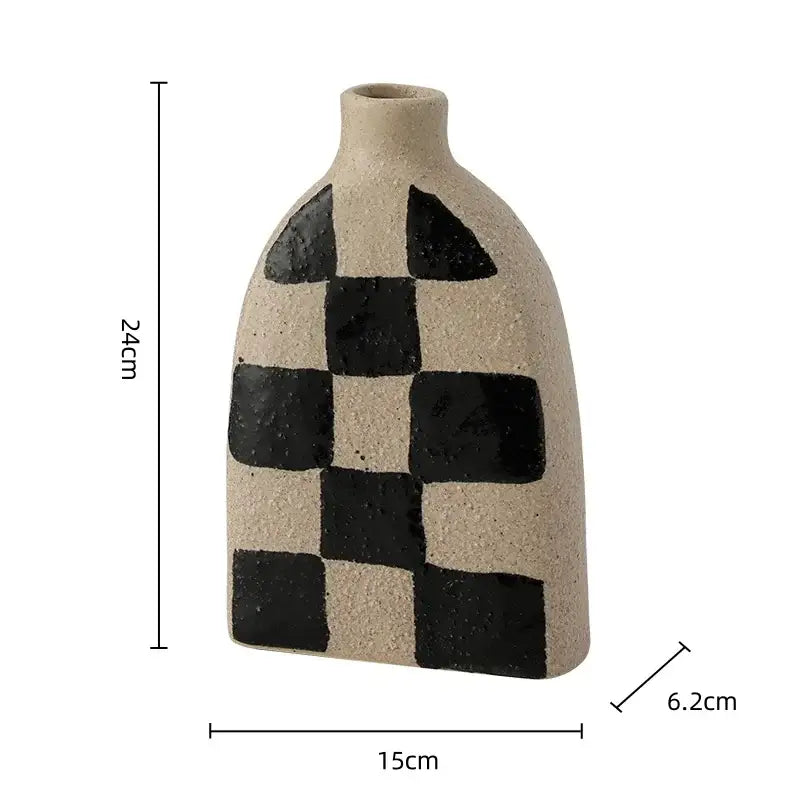 A beige ceramic vase with a textured surface and black geometric check pattern for living room decorbites geometric check decor