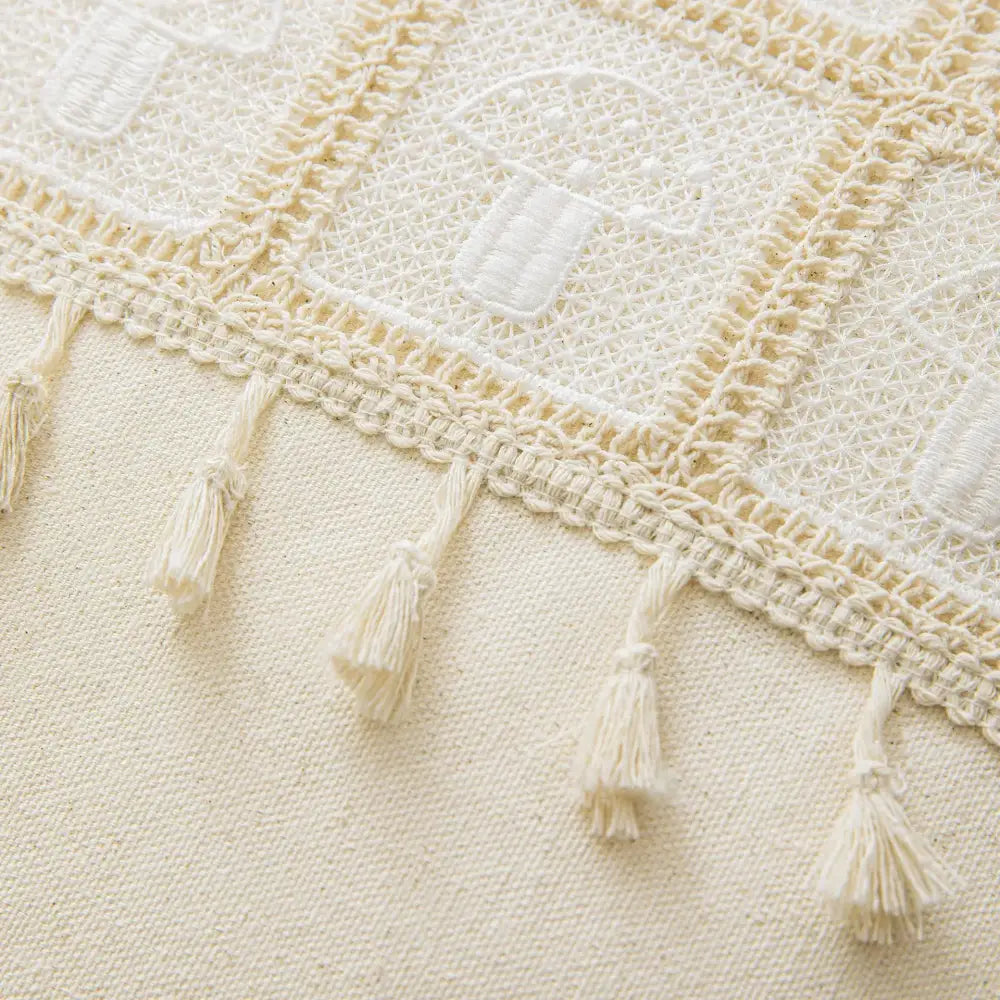 Cream-colored crochet throw blanket with embroidered lantern motifs and tassels for decorbites geometric checker cushion cover