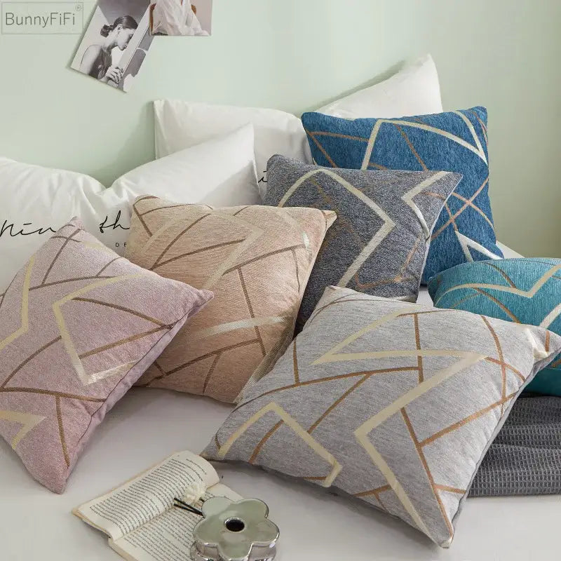 A collection of decorbites geometric chenille cushion covers in teal gray pink with metallic gold and cream lines for living room decor