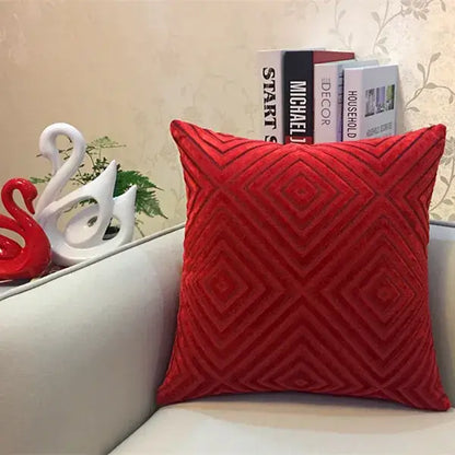 Vibrant red velvet cushion cover with textured geometric diamond pattern in chenille flocking for decorbites geometric chenille decor