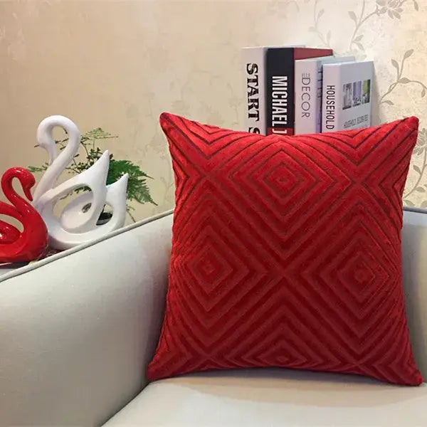 Vibrant red velvet cushion cover with textured geometric diamond pattern in chenille flocking for decorbites geometric chenille decor
