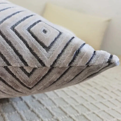 A soft gray chenille flocking cushion cover with bold black geometric patterns for living room decor by decorbites geometric chenille