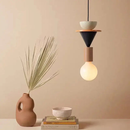 Modern geometric pendant light with matte black cone beige cylinder and wooden platform holding white bowl for decorbites led wooden use