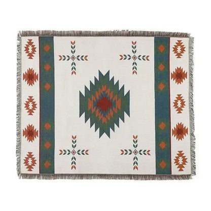 White woven geometric cotton knitted sofa blanket with teal rust dark green diamond pattern and fringed edges for decorbites
