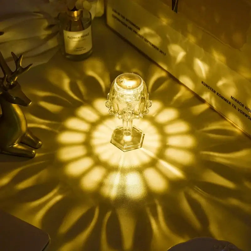 A crystal diamond led night light with a clear faceted glass design casts warm golden light for bedroom reading