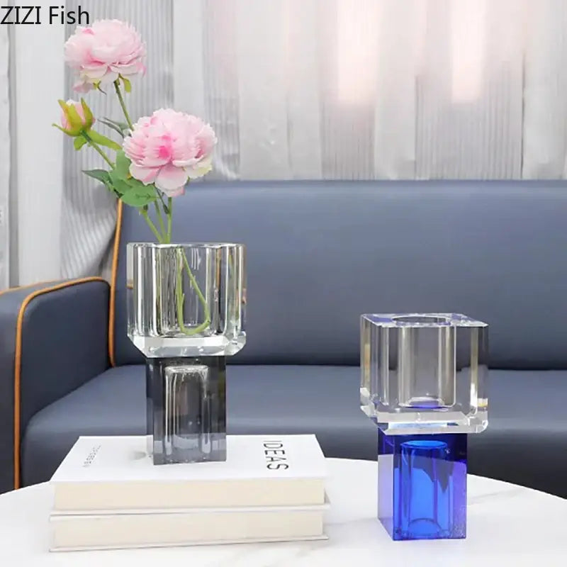 Clear glass crystal glass vase with geometric facets and dark gray base holding artificial flowers decorbites decor