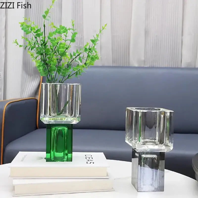 Geometric crystal glass vase with green base and vertical ridges holding artificial flowers for decorbites decor