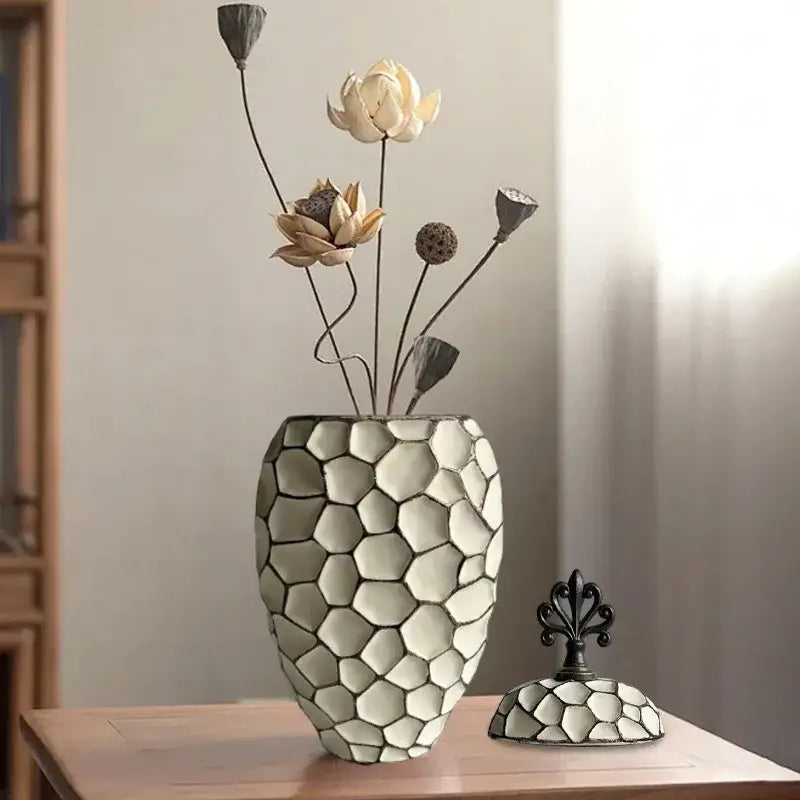 White ceramic vase with geometric diamond check mosaic pattern and matching lid for living room decor