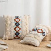 Cream-colored cushion cover with frayed edges and blue red geometric embroidered pattern for home decor by decorbites geometric embroidered