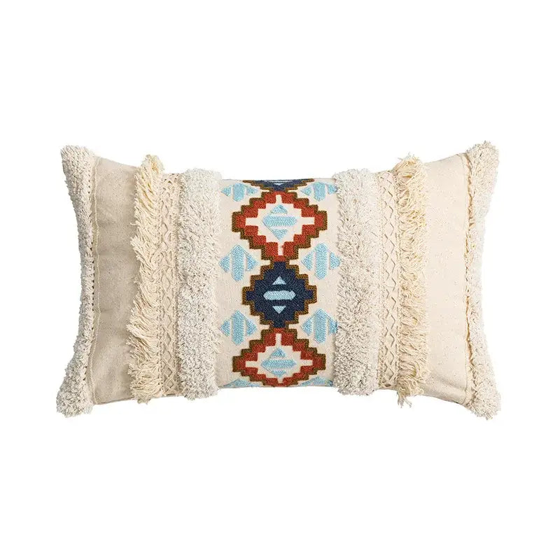Cream-colored cushion cover with central red blue beige geometric embroidery and textured fringe for home decor decorbites geometric embroidered