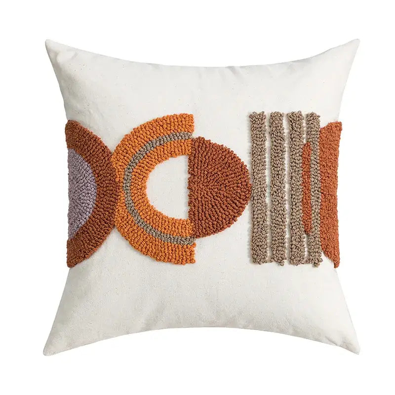 Cream-colored cushion cover with burnt orange taupe and gray geometric embroidered patterns for home decor by decorbites