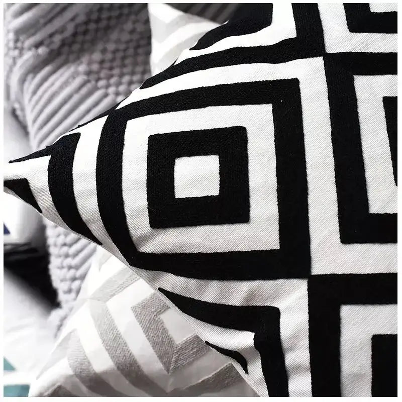 Black and white geometric embroidered cushion cover with bold modern design from decorbites for living room pillows decor