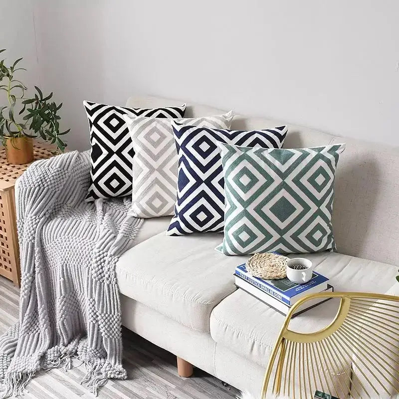 Set of four geometric embroidered cushion covers in black white navy blue and teal green for living room decorbites decor