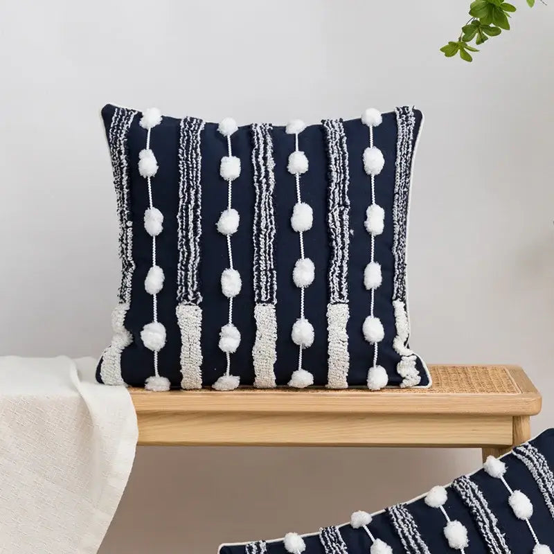 Navy blue cushion cover with white pom-pom tufted tassels and geometric embroidered decorbites design for bedroom decor