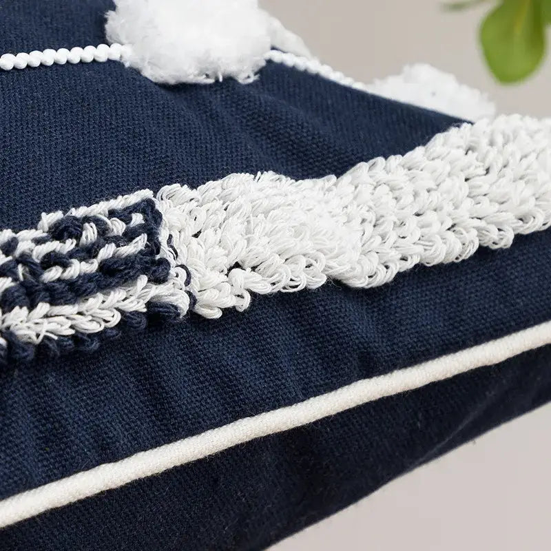 Navy blue cushion cover with white crochet trim and fluffy pom-pom tufted tassels decorbites geometric embroidered design