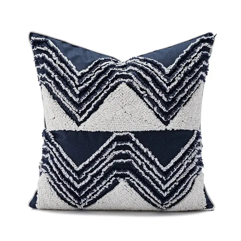 Navy and cream cushion cover with textured layered zigzag embroidery and tufted tassels decorbites geometric embroidered decor
