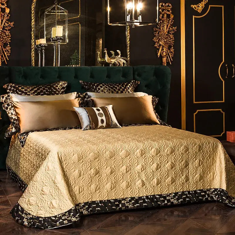 Luxurious emerald green tufted velvet headboard with ornate gold trim in a geometric embroidered egyptian cotton bedding set