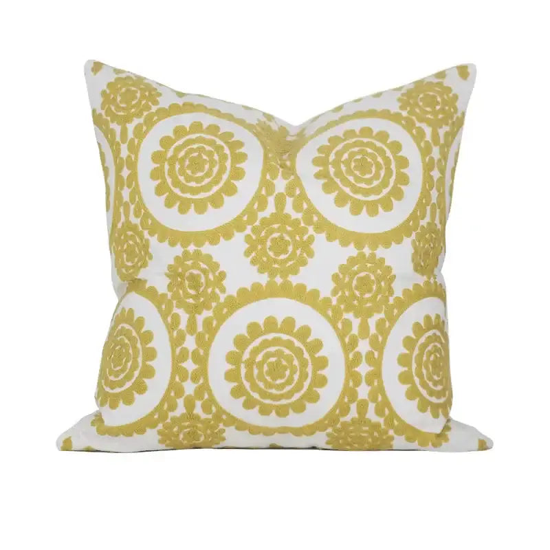 A geometric embroidered noble white cushion cover with mustard-yellow floral patterns for decorbites cushion covers