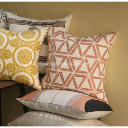 A square cushion cover with geometric embroidered noble terracotta and cream fabric for living room decorbites
