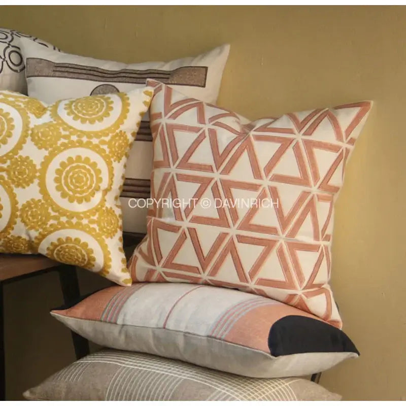 A square cushion cover with geometric embroidered noble terracotta and cream fabric for living room decorbites